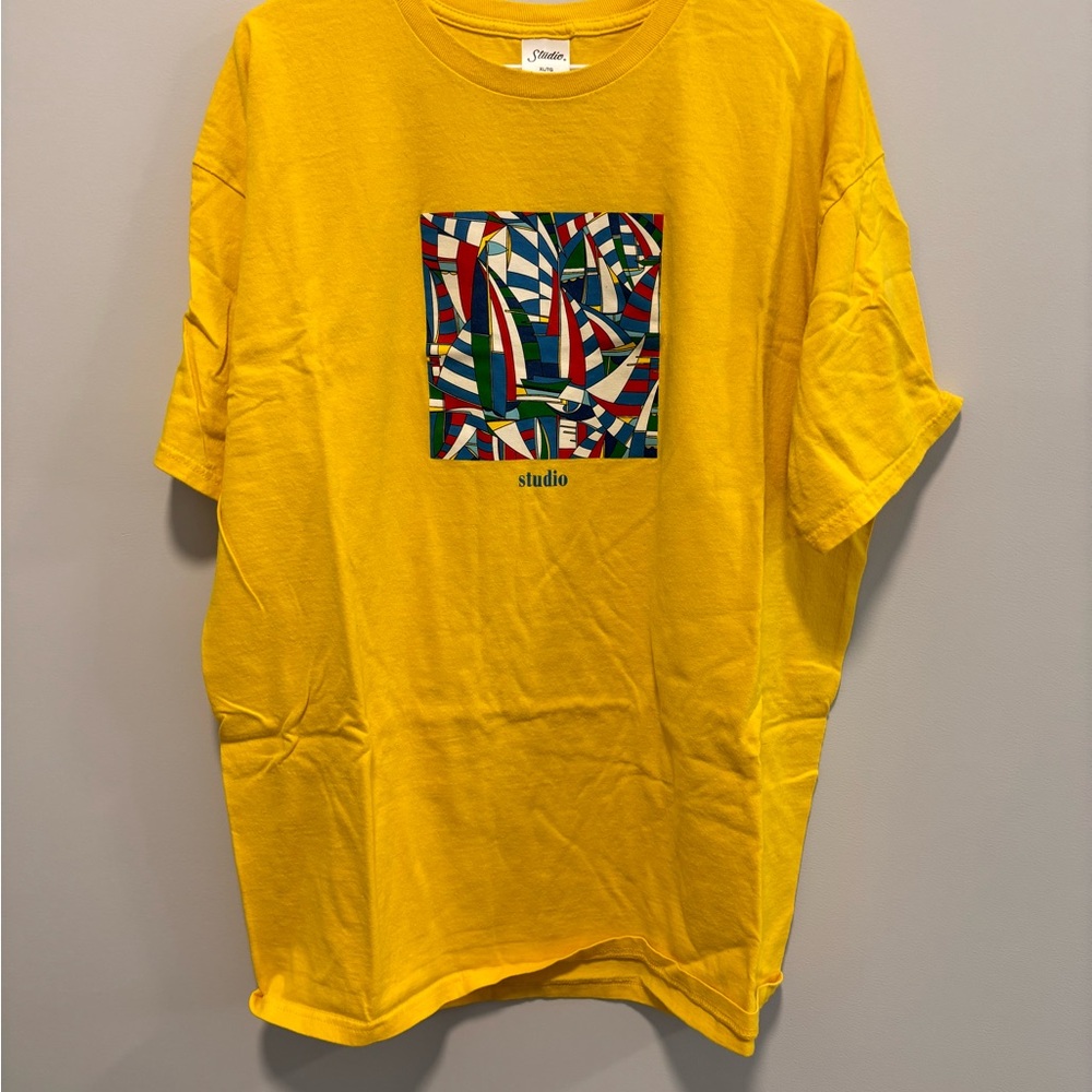 Yellow Studio Skateboard T-Shirt with Abstract Design